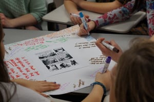 students responding to Maus on big paper