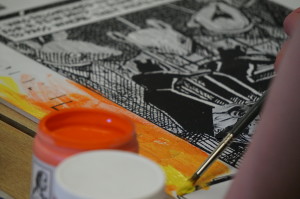  Student painting artwork in response to panel from Maus