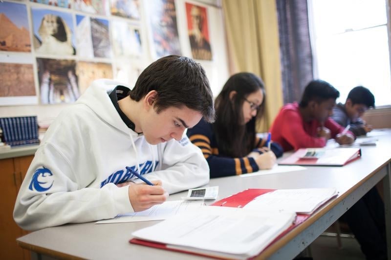 Students in a Facing History classroom use journals to record reflections and questions.  Photo credit: Nick Kozak