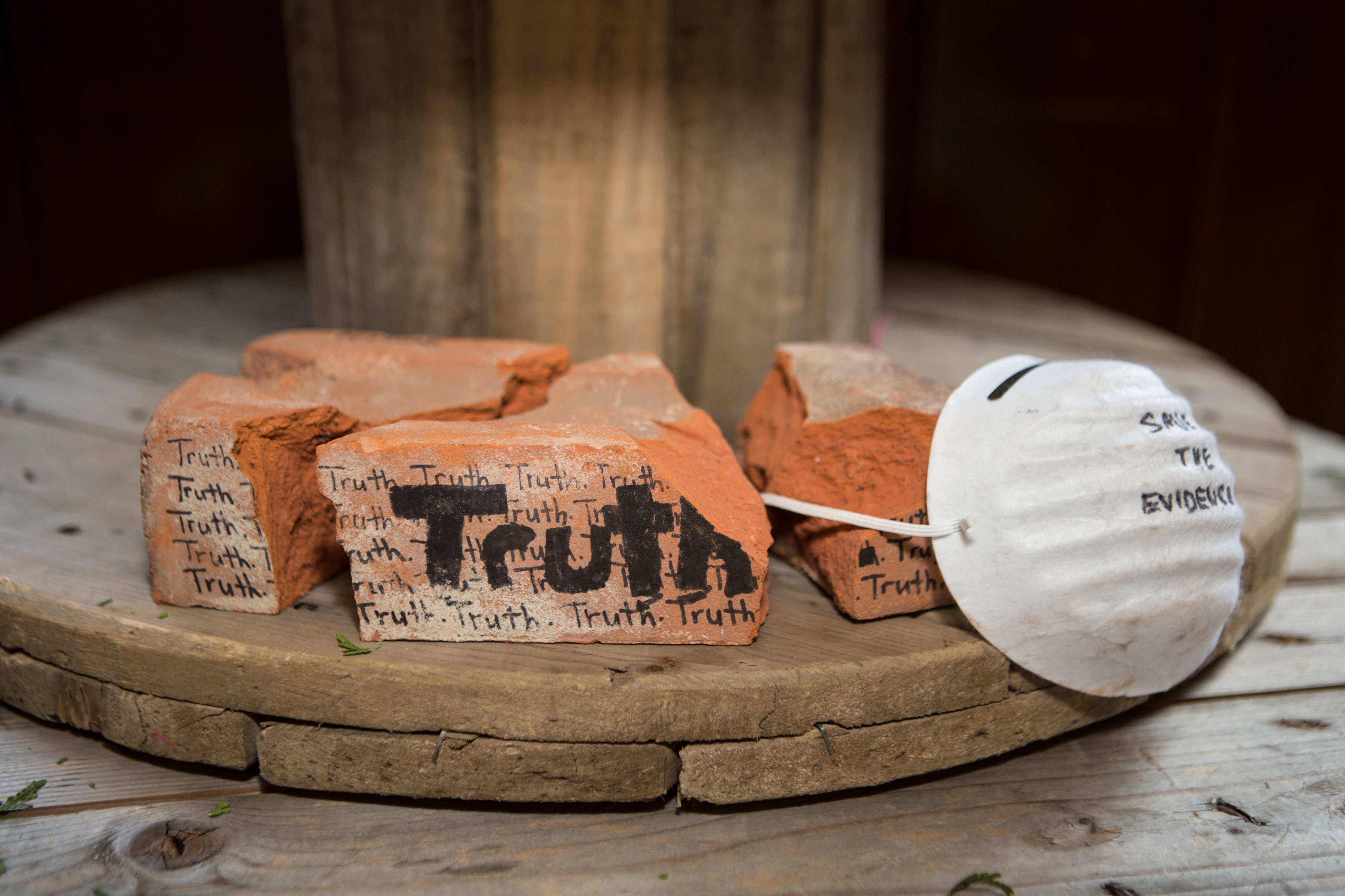 Students create a model memorial using broken bricks with the words Truth written on them for residential school survivors and those who did not survive in response to a visit to the former Mohawk Institute residential school and contemporary testimony of intergenerational survivor Kim Wheatley.  Photo courtesy Nick Kozak for Facing History and Ourselves.